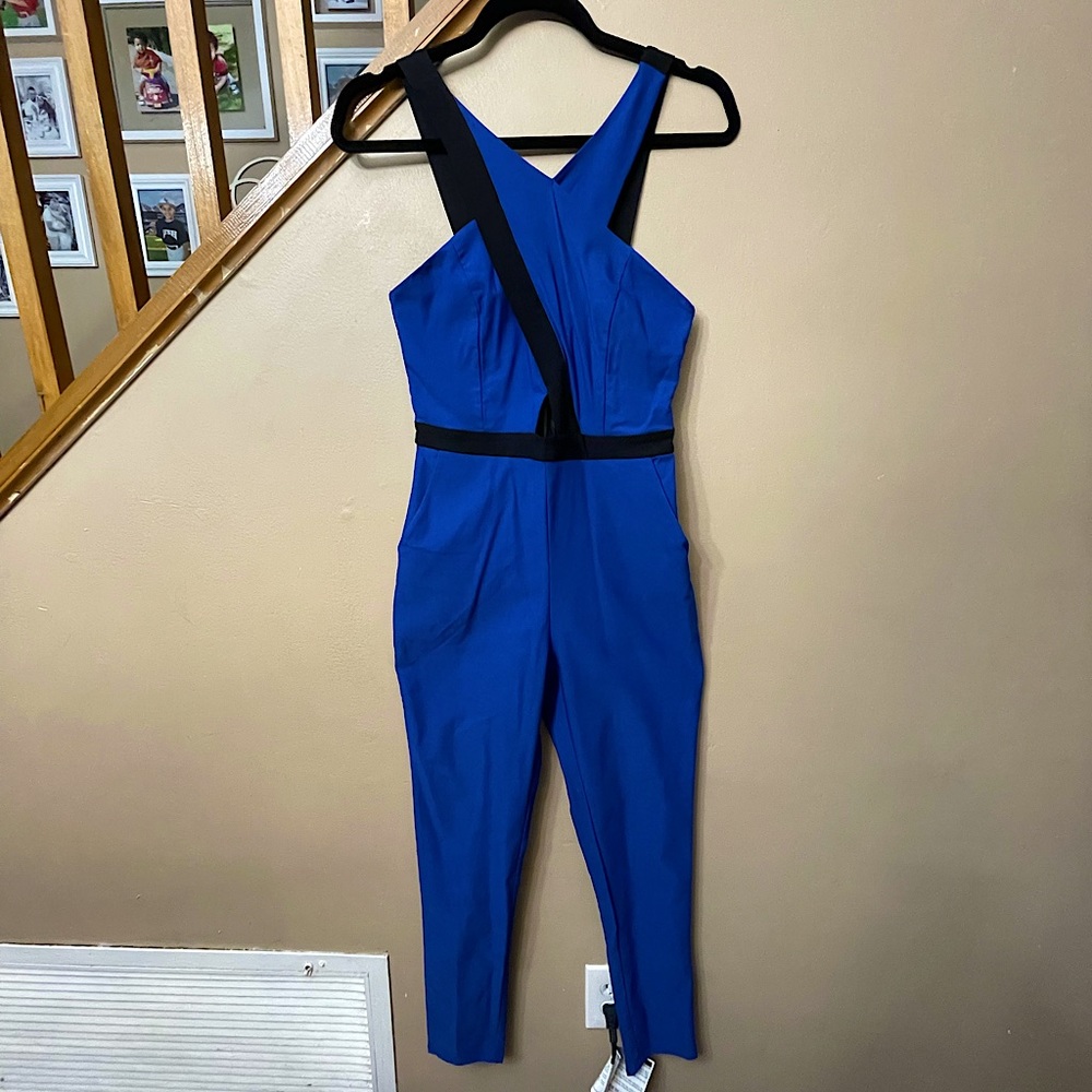 Material girl royal blur jumpsuit. Size M, spandex, features peekaboo keyhole.
